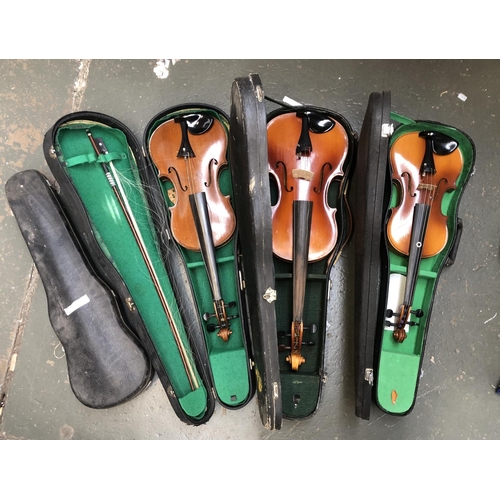 1243 - A Schmidt violin, together with one other, a viola, all cased, and an empty violin case