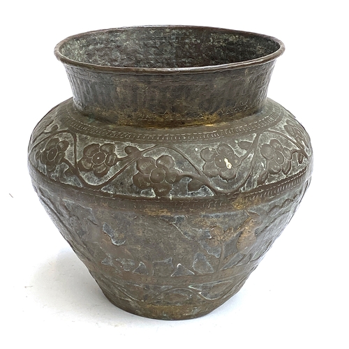 1239 - A large Eastern brass pot chased with a band of scrolling flowers and camels, 33cmH