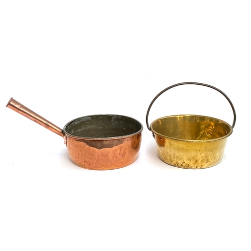 1244 - A large copper saucepan with riveted handle; together with a brass pan with iron loop handle, each a... 