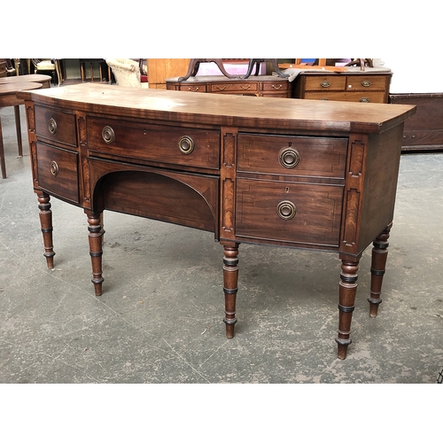 1328 - A Regency mahogany bow-front sideboard, two central drawers flanked by cellerett drawer and two othe... 