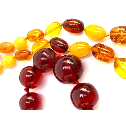 137 - A cherry amber bakelite type beaded necklace, beads graduating from approx. 0.9cm to 1.5cm, gross we... 