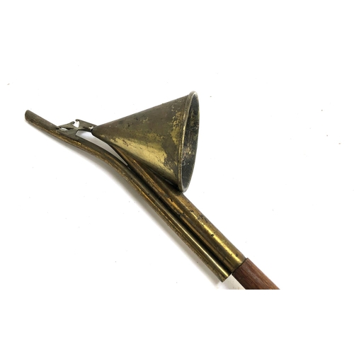 1321 - An ecclesiastical candle snuffer, 110cmL