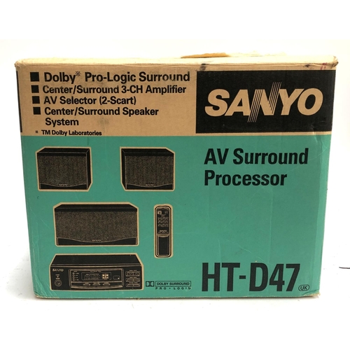 1329 - A Sanyo Surround Sound System to include 3 speakers, amplifier, remote, and instructions