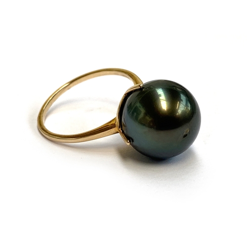 10 - A 9ct gold Tahitian cultured pearl ring, the large grey pearl 14x14mm, size R 1/2