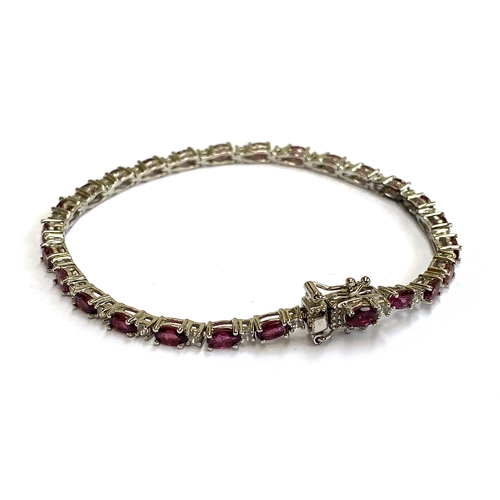 12 - A sterling silver bracelet set with alternating pink rubellite tourmaline and natural white zircons,... 