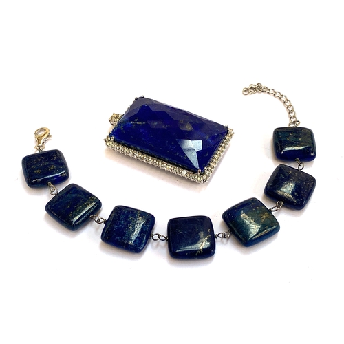 22 - A sterling silver lapis lazuli bracelet, 16cmL; together with a large lapis lazuli and white topaz p... 