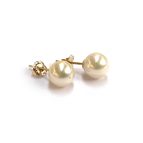 28 - A pair of 9ct gold and Akoya pearl stud earrings, the pearls 0.7cmD