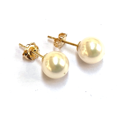 28 - A pair of 9ct gold and Akoya pearl stud earrings, the pearls 0.7cmD