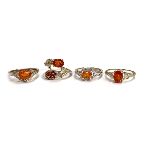 32 - A further group of sterling silver mandarin garnet rings, the garnets 1.5cts, 1.34cts, 2.0cts, and 1... 