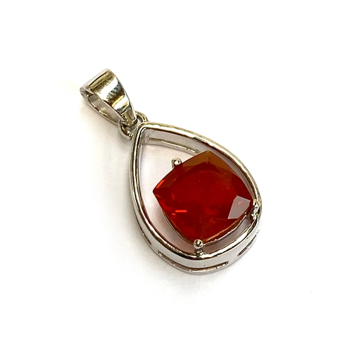 9 - A sterling silver pendant set with a fire opal, the cushion cut opal 2.2cts and 9x9mm, the pendant 1... 