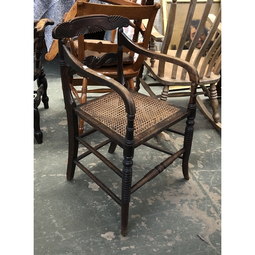 1254 - A Regency open armchair with caned set, on ring turned legs and stretchers