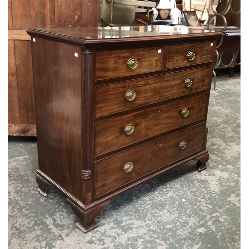 1257 - A George III mahogany chest of two short over three long drawers, flanked by fluted quarter columns,... 