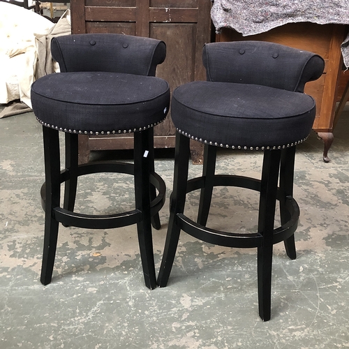 1294 - A pair of contemporary upholstered and close studded bar stools, the seats approx. 78cmH