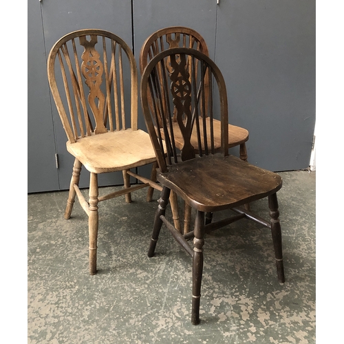 1295 - A pair of wheelback Windsor side chairs; with one other