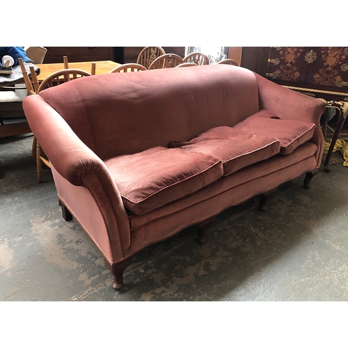 1303 - A three seater sofa upholstered in pink velvet fabric, 202cmW