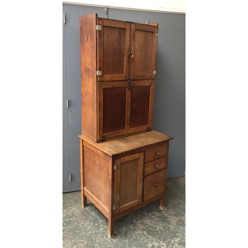 1314 - An 'Easiwork' vintage oak kitchen cabinet, the top with two sets of cupboards, over a base with furt... 