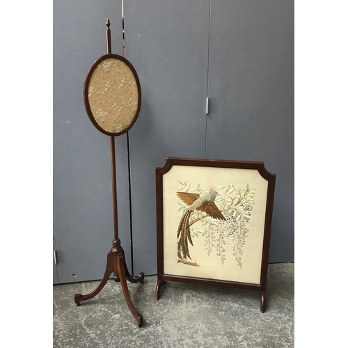 1332 - A glazed embroidered fire screen depicting a fancy bird, 67cmW; together with a pole fire screen, 14... 