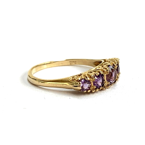 113 - A 9ct gold and amethyst five stone ring, size P, 2.8g