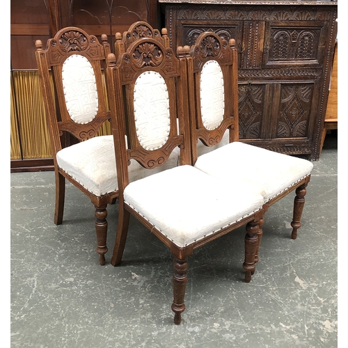 1238 - A set of four carved and upholstered dining chairs