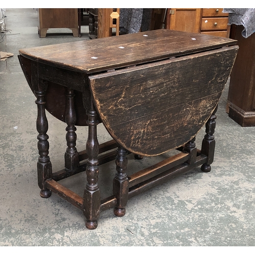 1269 - A 17th century and later oak oval gateleg table, 107x53x75cmH