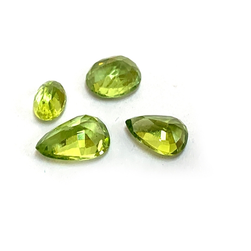 90 - Four loose peridot totalling approx. 4.8cts