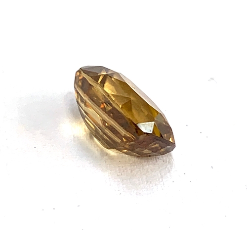 96 - A loose honey citrine, oval cushion cut, approx. 5cts, 10.5x7.5mm