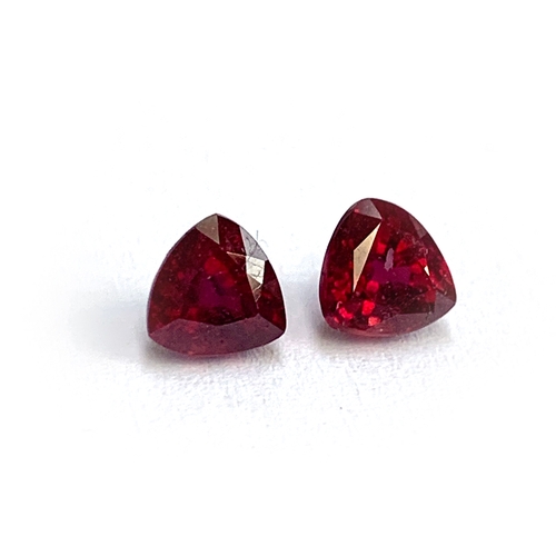 97 - Two loose trillion cut rubies, totalling approx. 1.7cts