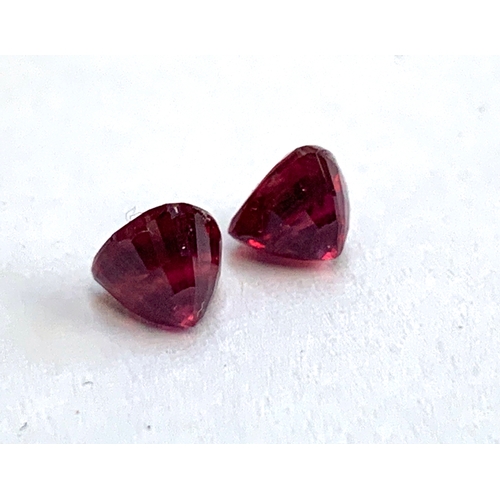 97 - Two loose trillion cut rubies, totalling approx. 1.7cts