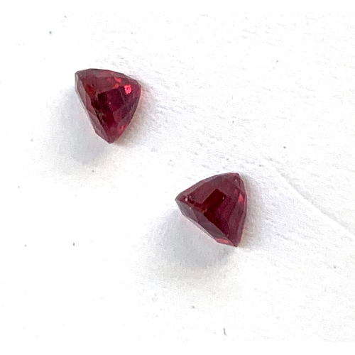 97 - Two loose trillion cut rubies, totalling approx. 1.7cts