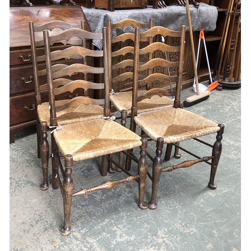 1312 - A set of four ash ladderback chairs with rush seats