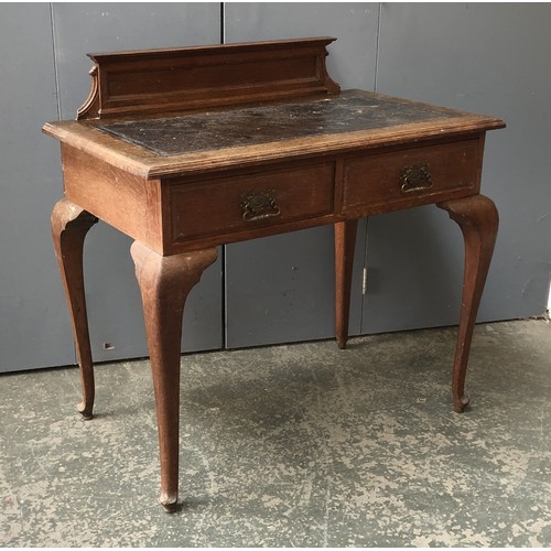 1342 - A late 19th century oak writing desk, with inset leather skiver and two drawers, on cabriole legs, b... 