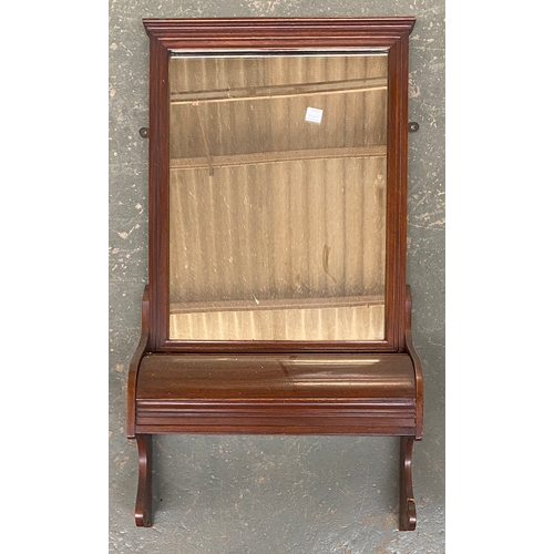 1272 - An early 20th century mahogany hall mirror with lidded compartment below, 79x42cm