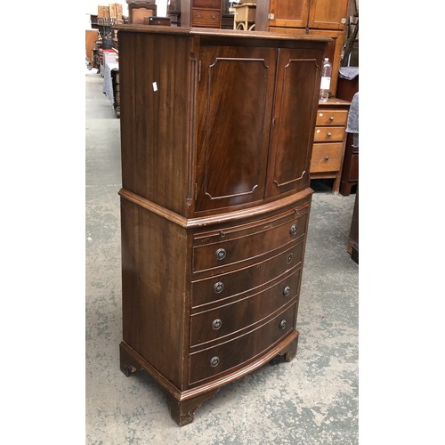 1263 - A mahogany cabinet with two cupboard doors above slide and four drawers, 130cmH