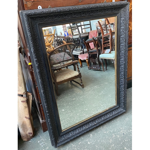 1399 - A 19th century ebonised picture frame with mirrored plate, 127x96cm