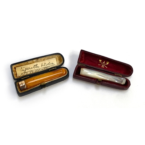 152 - A 15ct gold and amber cigarette holder, in a fitted leather case; together with one other mother of ... 