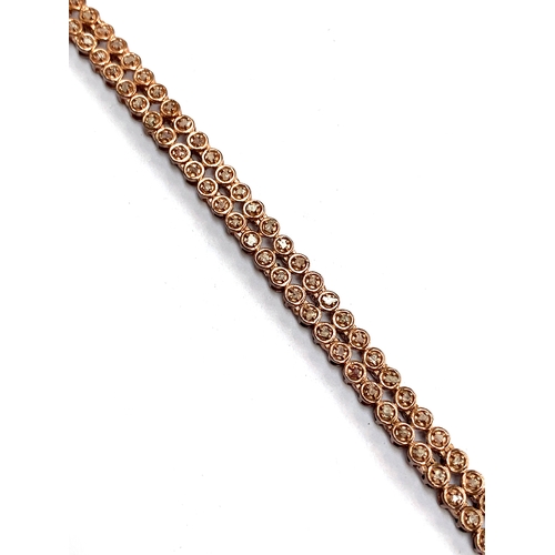 124 - A 925 silver rose gold vermeil bracelet set with natural pink diamonds totalling 0.5cts, 19.5cmL