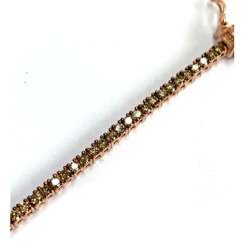 125 - A 925 silver bracelet set with natural champagne diamonds, the diamonds totalling approx 3cts, 19cmL