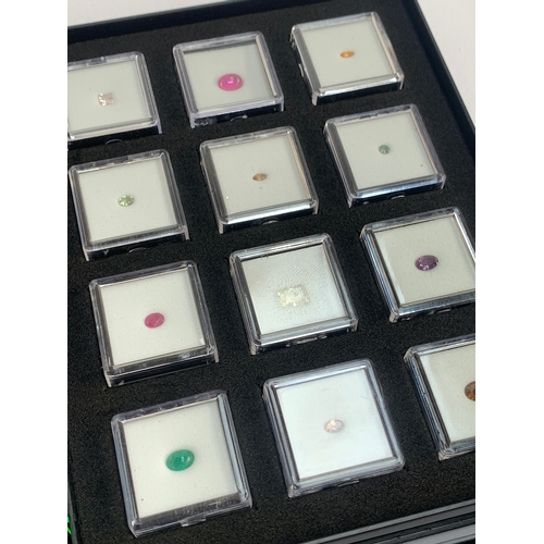 136 - Four 'Gem Collector' specimen display trays containing a variety of gems, including sapphires, garne... 