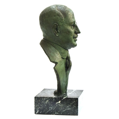 1367 - Emiel Hartman (20th Century), A large patinated bronze portrait bust of a bespectacled gentleman, on... 