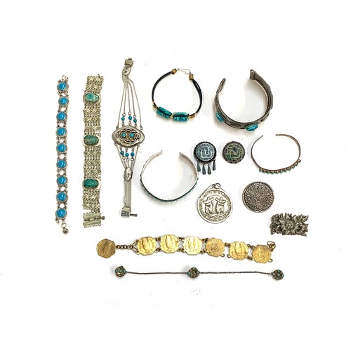 68 - A quantity of Mexican and Egyptian white metal jewellery, some set with turquoise, faience scarabs a... 