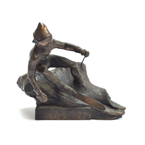 112 - A bronze sculpture of a man skiing, 17cm high