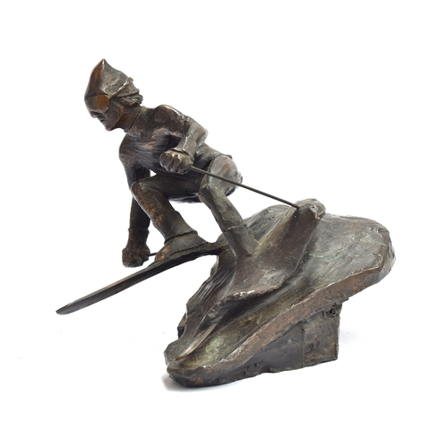 112 - A bronze sculpture of a man skiing, 17cm high