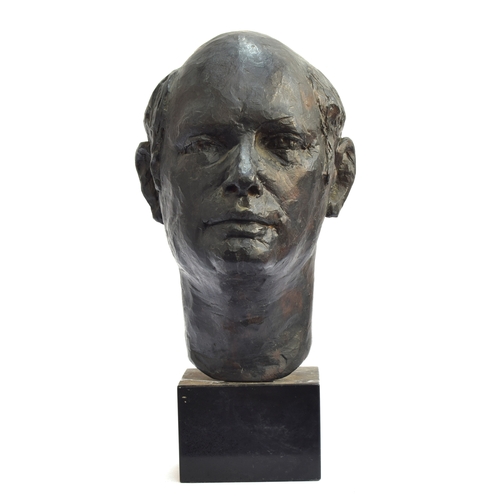 114 - A 20th century bronze portrait bust of a man, signed indistinctly to reverse, on a polished slate pl... 