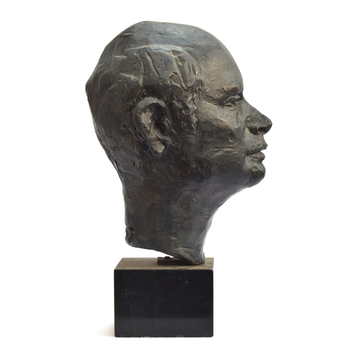 114 - A 20th century bronze portrait bust of a man, signed indistinctly to reverse, on a polished slate pl... 