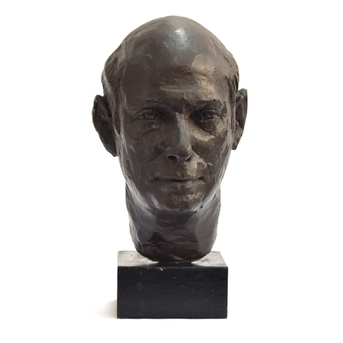 115 - A 20th century bronze portrait bust of a man, signed indistinctly to reverse, on a black painted pli... 