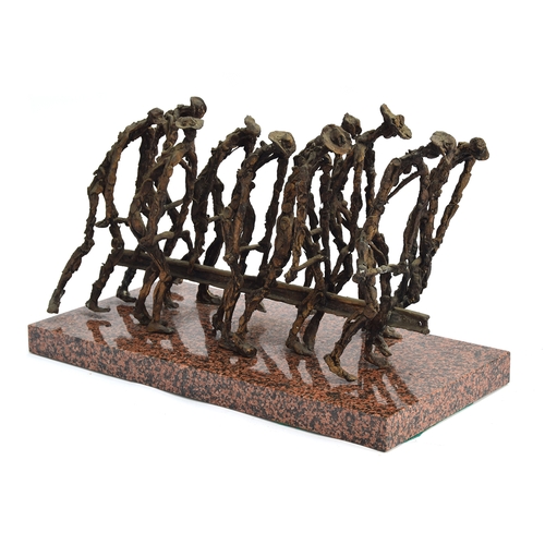 118 - A 20th century bronze abstract sculpture, workmen carrying a girder, 32cm high, the red granite plin... 