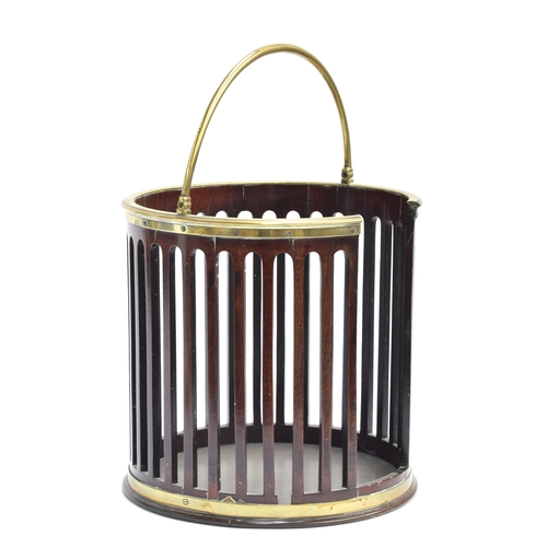 403 - A George III mahogany and brass bound plate bucket with pierced sides and brass hoop handle, 30cm di... 