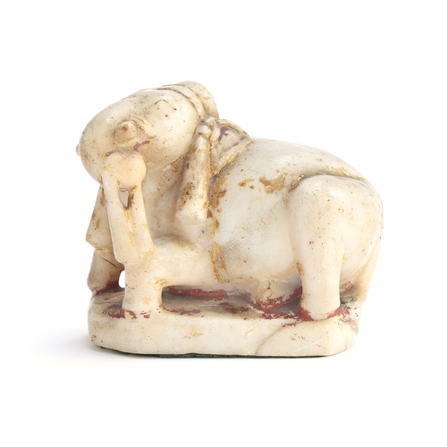 228 - A 19th century Indian carved alabaster figure of an elephant, remnants of gilt paint, 13cm high