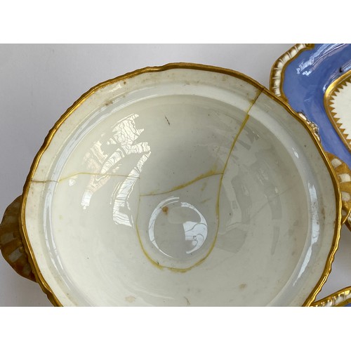 184 - A 19th century porcelain part dinner service, periwinkle blue heightened in gilt, comprising side pl... 