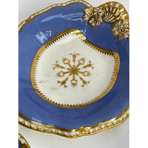 184 - A 19th century porcelain part dinner service, periwinkle blue heightened in gilt, comprising side pl... 